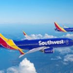 Southwest Airlines aircraft flying above the clouds