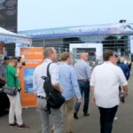 A group of visitors exploring the Farnborough Airshow 2022 site