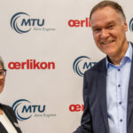 Dr. Silke Maurer, COO at MTU Aero Engines, and Dr. Sven Hicken, CTO of Oerlikon Surface Solutions, sign the partnership agreement on future development cooperation at the Paris Air Show.