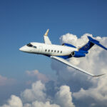 The Bombardier Challenger 3500 flying through the clouds