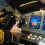 Pilot in the cockpit working with AI technology