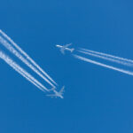 Singapore Airlines Airbus A380 flying at cruising altitude with a Lufthansa Boeing 747 flying in close proximity.