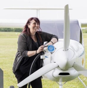 Kerry Wilmot, NEBOAir co-director, with the Velis Electro aircraft