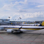 Singapore Airlines planes parked on tarmac at Changi Airport